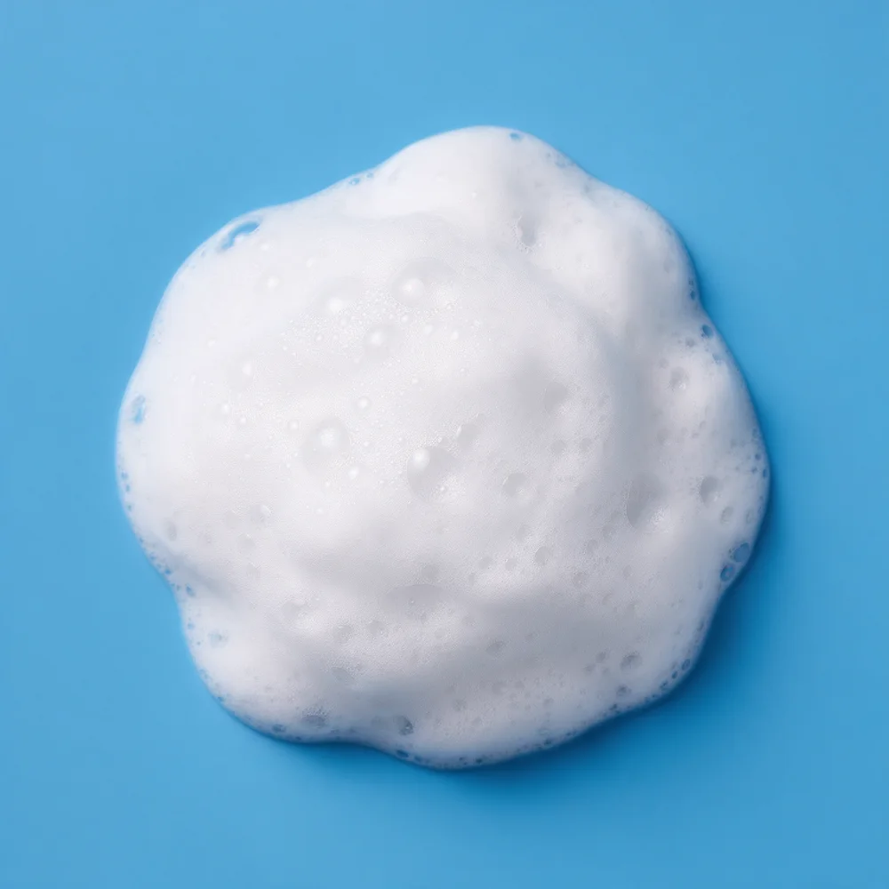 White cleansing foam on a blue background